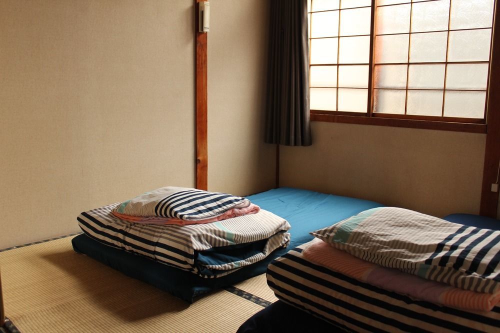 Guest House Shikotsu Kamui Тітосе Екстер'єр фото